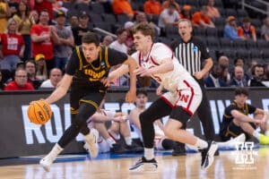 Nebraska Cornhusker forward Braden Frager (5) guards Iowa Hawkeye forward Alvaro Folgueiras (7) in the first half during the Sweet Sixteen of the NCAA Men’s Basketball Championship on Thursday, March 26, 2026, in Houston. Photo by John S. Peterson.