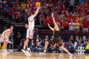 Nebraska Cornhusker forward Braden Frager (5) makes a three point shot over Iowa Hawkeye forward Cooper Koch (8) in the first half during the Sweet Sixteen of the NCAA Men’s Basketball Championship on Thursday, March 26, 2026, in Houston. Photo by John S. Peterson.