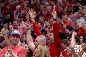 Nebraska Cornhusker fans celebrate a three point basket against the Iowa Hawkeyes in the first half during the Sweet Sixteen of the NCAA Men’s Basketball Championship on Thursday, March 26, 2026, in Houston. Photo by John S. Peterson.