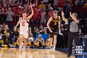 Nebraska Cornhusker forward Pryce Sandfort (21) celebrates making a three point basket against the Iowa Hawkeyes in the first half during the Sweet Sixteen of the NCAA Men’s Basketball Championship on Thursday, March 26, 2026, in Houston. Photo by John S. Peterson.