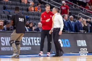 Nebraska Cornhusker head coach Fred Hoiberg and Iowa Hawkeye head coach Ben McCollum talk before the start of the game during the Sweet Sixteen of the NCAA Men’s Basketball Championship on Thursday, March 26, 2026, in Houston. Photo by John S. Peterson.
