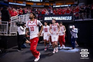 Nebraska Cornhuskers head out to the court to take on the Iowa Hawkeyes during the Sweet Sixteen of the NCAA Men’s Basketball Championship on Thursday, March 26, 2026, in Houston. Photo by John S. Peterson.
