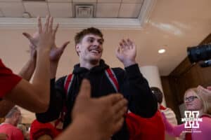 Nebraska Cornhusker Braden Frager gives high fives heading to the bus at the hotel to take on Iowa during the Sweet Sixteen of the NCAA Men’s Basketball Championship on Thursday, March 26, 2026, in Houston. Photo by John S. Peterson.