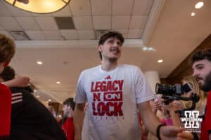 Nebraska Cornhusker forward Berke Büyüktuncel gives high fives heading to the bus at the hotel to take on Iowa during the Sweet Sixteen of the NCAA Men’s Basketball Championship on Thursday, March 26, 2026, in Houston. Photo by John S. Peterson.