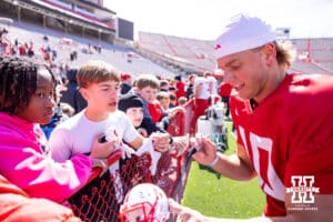 Nebraska Cornhusker quarterback Anthony Colandrea (10) signs an autograph during the Spring Game on Saturday, March 28, 2026, in Lincoln. Photo by John S. Peterson.