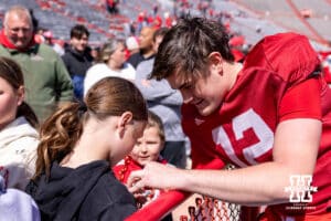 Nebraska Cornhusker quarterback Daniel Kaelin (12) signs an autograph during the Spring Game on Saturday, March 28, 2026, in Lincoln. Photo by John S. Peterson.