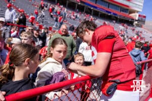Nebraska Cornhusker quarterback Daniel Kaelin (12) signs an autograph during the Spring Game on Saturday, March 28, 2026, in Lincoln. Photo by John S. Peterson.