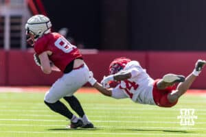 Nebraska Cornhusker wide receiver Jackson Carpenter (88) breaks a tackle by cornerback Amare Sanders (14) during the Spring Game on Saturday, March 28, 2026, in Lincoln. Photo by John S. Peterson.