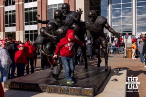 A little Nebraska Cornhusker fan plays with the statue before the Spring Game on Saturday, March 28, 2026, in Lincoln. Photo by John S. Peterson.