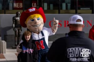 Nebraska Cornhusker fan poses for a photo with Herbie before the Spring Game on Saturday, March 28, 2026, in Lincoln. Photo by John S. Peterson.