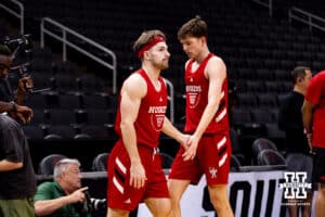 Nebraska Cornhusker Sam Hoiberg gives Pryce Sandfort five during media day at the NCAA Men’s Basketball Championship on Wednesday, March 25, 2026, in Houston. Photo by John S. Peterson.