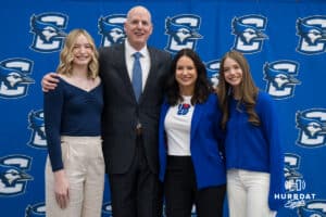 Creighton Bluejay head coach in waiting Alan Huss poses with his family during his introductory press conference on March 25, 2026, in Omaha, Nebraska. Photo by Brandon Tiedemann