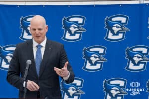Creighton Bluejay head coach in waiting Alan Huss jokes during his introductory press conference on March 25, 2026, in Omaha, Nebraska. Photo by Brandon Tiedemann