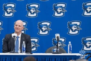 Creighton Bluejay head coach in waiting Alan Huss smiles during his introductory press conference on March 25, 2026, in Omaha, Nebraska. Photo by Brandon Tiedemann