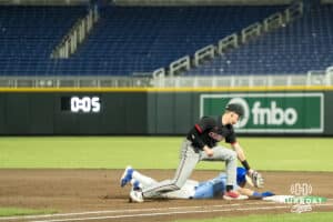 Omaha Maverick Jackson Trout (20) tags out a runner during a college baseball game against Creighton on March 24, 2026, in Omaha, Nebraska. Photo by Brandon Tiedemann