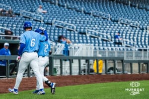 Creighton Bluejays Isaac Wachsmann (6) and Connor Capece (2) celebrate scoring during a college baseball game against Omaha on March 24, 2026, in Omaha, Nebraska. Photo by Brandon Tiedemann