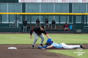 Omaha Maverick Chase Diggins (8) tags a runner out during a college baseball game against Creighton on March 24, 2026, in Omaha, Nebraska. Photo by Brandon Tiedemann