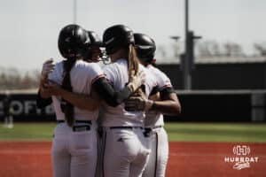 Omaha Mavericks gather to celebrate a home run against the North Dakota State Bison during a softball game at Connie Clausen Field, Friday, March 20, 2026, in Omaha, Nebraska. Photo by Collin Stilen.