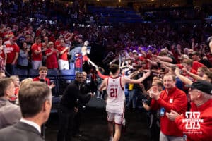 Nebraska Cornhusker forward Pryce Sandfort (21) gives the fans high fives after the win over the Troy Trojans during the first round of the NCAA Men’s Basketball Championship on Thursday, March 19, 2026, in Oklahoma City. Photo by John S. Peterson.
