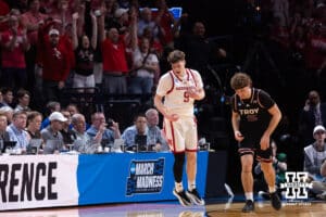 Nebraska Cornhusker forward Braden Frager (5) celebrates making a three point basket against Troy Trojan guard Austin Cross (95) in the second half during the first round of the NCAA Men’s Basketball Championship on Thursday, March 19, 2026, in Oklahoma City. Photo by John S. Peterson.