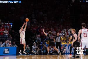 Nebraska Cornhusker forward Braden Frager (5) makes a three point basket from the corner against Troy Trojan guard Austin Cross (95) in the second half during the first round of the NCAA Men’s Basketball Championship on Thursday, March 19, 2026, in Oklahoma City. Photo by John S. Peterson.