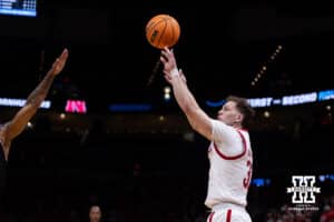 Nebraska Cornhusker guard Cale Jacobsen (31) makes a three point basket against the Troy Trojans in the second half during the first round of the NCAA Men’s Basketball Championship on Thursday, March 19, 2026, in Oklahoma City. Photo by John S. Peterson.