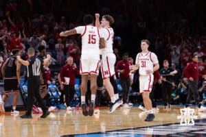 Nebraska Cornhusker Braden Frager (5) and Jared Garcia (15) chest bump at a time out against the Troy Trojans in the second half during the first round of the NCAA Men’s Basketball Championship on Thursday, March 19, 2026, in Oklahoma City. Photo by John S. Peterson.