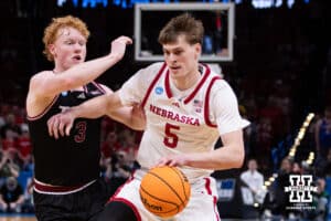 Nebraska Cornhusker forward Braden Frager (5) dribbles the ball against Troy Trojan guard Cooper Campbell (3) in the second half during the first round of the NCAA Men’s Basketball Championship on Thursday, March 19, 2026, in Oklahoma City. Photo by John S. Peterson.
