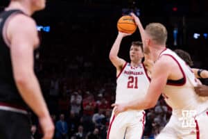 Nebraska Cornhusker forward Pryce Sandfort (21) makes a three point basket against the Troy Trojans in the second half during the first round of the NCAA Men’s Basketball Championship on Thursday, March 19, 2026, in Oklahoma City. Photo by John S. Peterson.