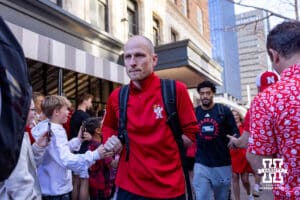 Nebraska Cornhuskers assistant coach Nate Loenser walks to the bus during the first round of the NCAA Men’s Basketball Championship on Thursday, March 19, 2026, in Oklahoma City. Photo by John S. Peterson.