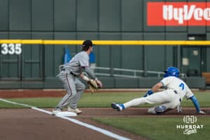 Creighton Bluejay Teddy Deters (4) slides to beat the throw during a college baseball game against Omaha on March 18, 2026, in Omaha, Nebraska. Photo by Brandon Tiedemann