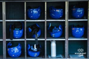 Creighton Bluejay helmets sit inside their cubbies during a college baseball game against Omaha on March 18, 2026, in Omaha, Nebraska. Photo by Brandon Tiedemann