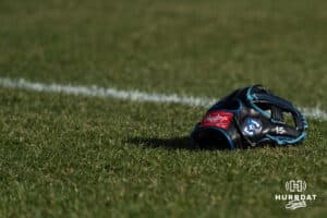 A Creighton Bluejay glove sits in the field during a college baseball game against Omaha on March 18, 2026, in Omaha, Nebraska. Photo by Brandon Tiedemann