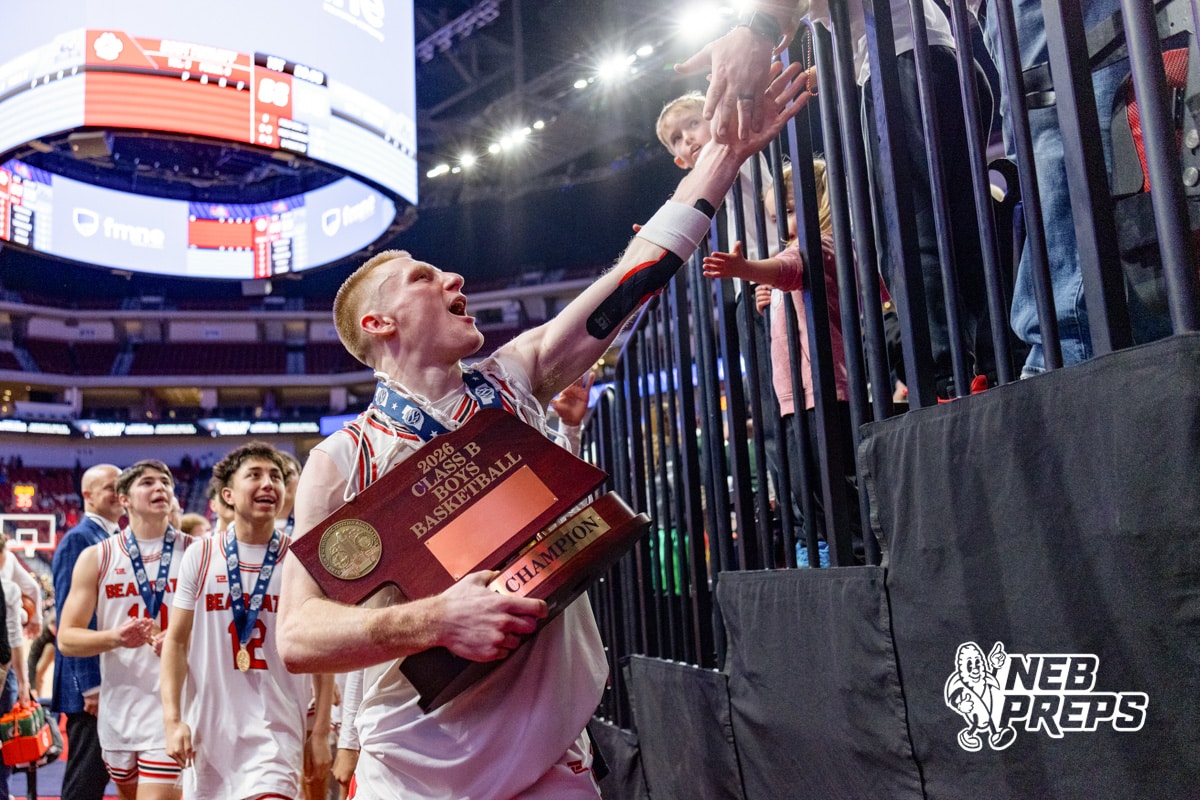 Scottsbluff’s Nate Kelly (5) is celebrating with fans after winning a high school state championship basketball game against Elkhorn North on March 14, 2026 in Lincoln, Nebraska. Photo By Jack Stephens.