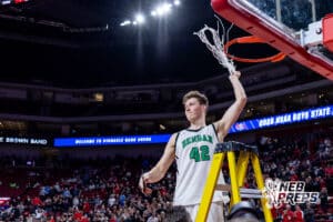 Bergan Catholic’s Gavin Baker (42) is swinging the net around after cutting it after winning a high school state championship basketball game against Norfolk Catholic on March 14, 2026 in Lincoln, Nebraska. Photo By Jack Stephens.
