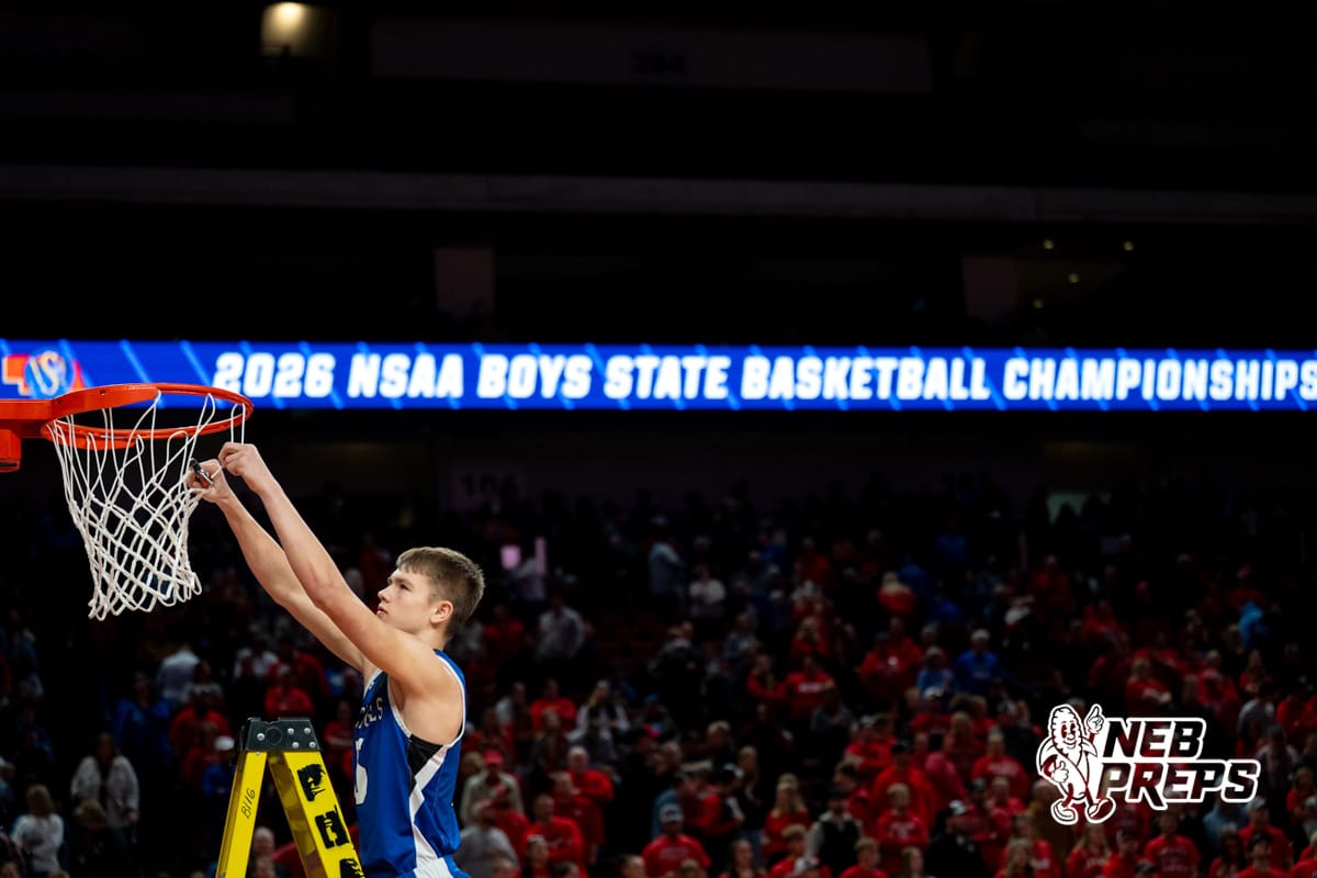 NSAA Boys Basketball Finals | Mar. 14, 2026 An Archangel Catholic player takes his cut of the net after defeating Elgin Public / Pope John during a boys state final basketball game, Mar. 14, 2026, Lincoln, Nebraska. Photo by Braden Cochran.