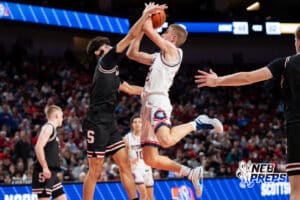 Norris's Evan Greenfield (22) blocked by Scottsbluff's Rylee Meininger (1) during a Boys State Championship Semifinal Round basketball game Friday, March 13, 2026, in Lincoln, Nebraska. Photo by Jackson D. Luethje.