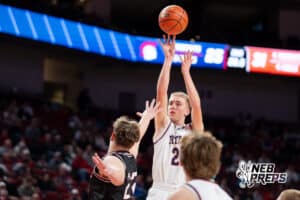 Norris's Evan Greenfield (22) shoots over Scottsbluff's Kobe Strom (22) during a Boys State Championship Semifinal Round basketball game Friday, March 13, 2026, in Lincoln, Nebraska. Photo by Jackson D. Luethje.