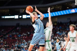 Elkhorn North's Kellen Murphy (23) shoots over Omaha Skutt's Carter Wissink (14) during a Boys State Championship Semifinal Round basketball game Friday, March 13, 2026, in Lincoln, Nebraska. Photo by Jackson D. Luethje.