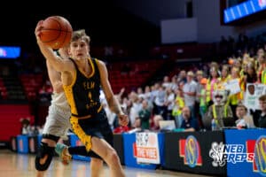Elm Creek forward Ethan Fries (1) reaches for a all headed towards the baseline during a boys state semifinal basketball game, Mar. 13, 2026, Lincoln, Nebraska. Photo by Braden Cochran.
