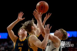 A pair of Elm Creef defenders fight for a ball with a Howells-Dodge player during a boys state semifinal basketball game, Mar. 13, 2026, Lincoln, Nebraska. Photo by Braden Cochran.