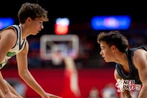 A Freeman Falcon basketball player looks to make a move around a Bergan Catholic defender during a boys state semifinal basketball game, Mar. 13, 2026, Lincoln, Nebraska. Photo by Braden Cochran.