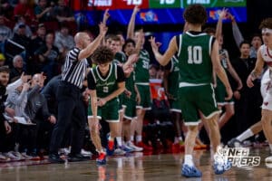 Lincoln Southwest’s Uzziah Sanders (2) and Makkiah Sanders (10) are celebrating after Uzziah hit a three point shot during a high school basketball game against Westside in the semifinals of the NSAA boys state basketball tournament on March 11, 2026 in Lincoln, Nebraska. Photo By Jack Stephens.