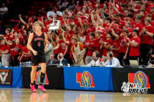 Norfolk Christian guard Gavin Schutt (4) reels back to play defense after his student section cheers after his three pointer during a boys state semifinal basketball game, Mar. 13, 2026, Lincoln, Nebraska. Photo by Braden Cochran.