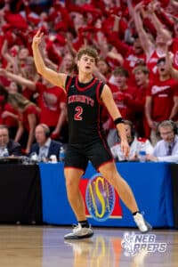 Norfolk Christian Knight Callen Marshall (2) holds up three fingers after drilling a three point shot during a boys state semifinal basketball game, Mar. 13, 2026, Lincoln, Nebraska. Photo by Braden Cochran.