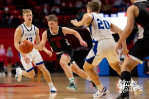 St Mary's point guard Logan Brabec (0) dribbles through a pair of defenders during a boys state semifinal basketball game, Mar. 13, 2026, Lincoln, Nebraska. Photo by Braden Cochran.