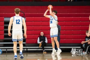 Norfolk Lutheran's Cole Lawless (24) shoots a three during a Boys State Championship First Round basketball game Thursday, March 12, 2026, in Lincoln, Nebraska. Photo by Jackson D. Luethje.