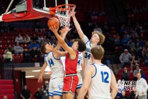 Mead’s Derrick Seay (4) layup guarded by Norfolk Lutheran's D'artagnan Taylor (34) and Gavin Feddern (14) during a Boys State Championship First Round basketball game Thursday, March 12, 2026, in Lincoln, Nebraska. Photo by Jackson D. Luethje.