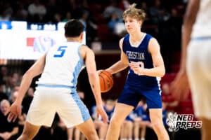 Lincoln Christian's Cooper Torell (22) guarded by Ashland-Greenwood's Cal Kissinger (5) during a Boys State Championship First Round basketball game Thursday, March 12, 2026, in Lincoln, Nebraska. Photo by Jackson D. Luethje.