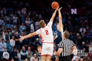 DC West's Zane Wohlers (2) tips off against Grand Island Central Catholic's Connor Haney (35) during a Boys State Championship First Round basketball game Thursday, March 12, 2026, in Lincoln, Nebraska. Photo by Jackson D. Luethje.